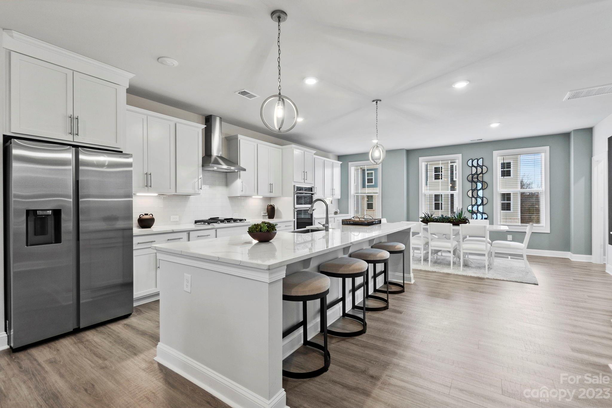 4513 Forsyth Place Fort Mill, SC 29708 - Photo 8 of 24 a kitchen with counter space appliances and wooden floor