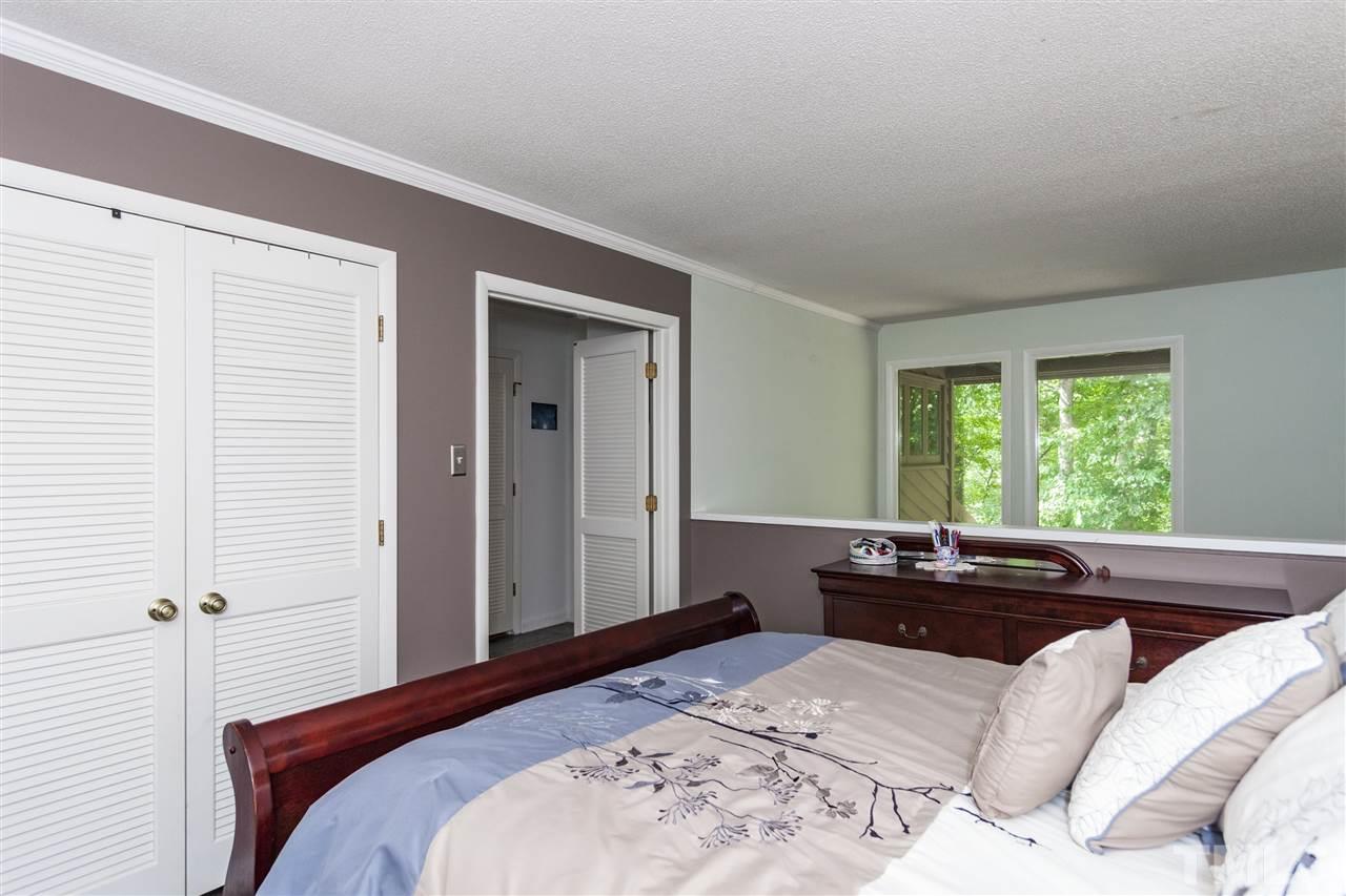43 Stoneridge Road Durham, NC 27705 - Photo 14 of 24 a bedroom with a bed and a large window