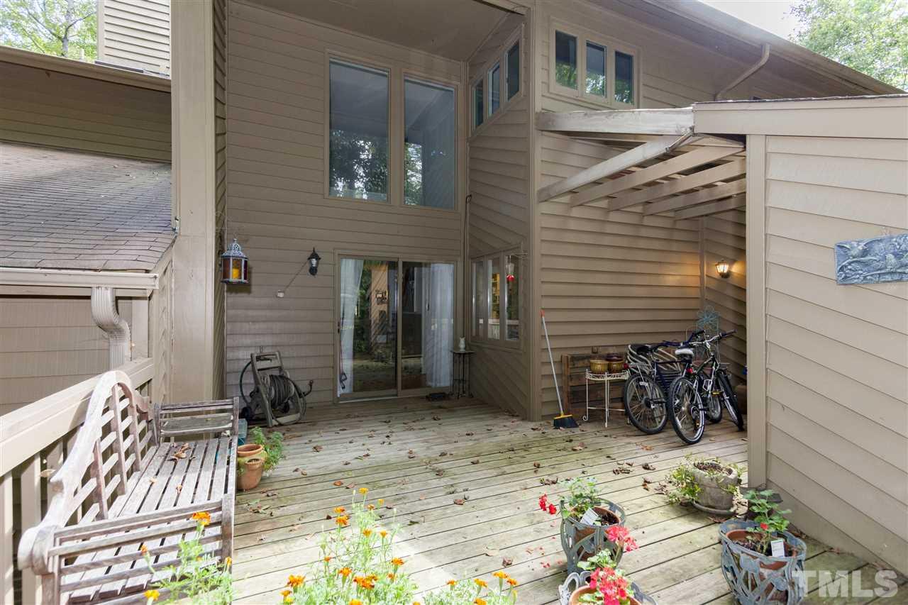 43 Stoneridge Road Durham, NC 27705 - Photo 23 of 24 a view of backyard with a chair and potted plants