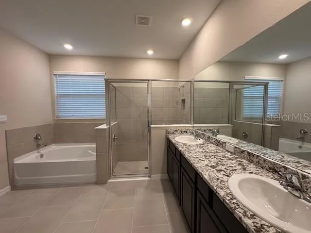 a bathroom with a sink a toilet and a light fixture