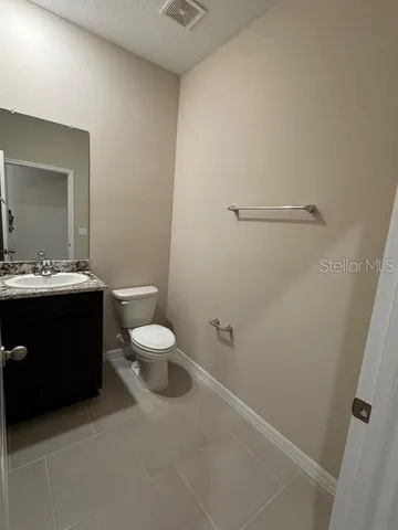 a kitchen with stainless steel appliances a refrigerator and a stove top oven