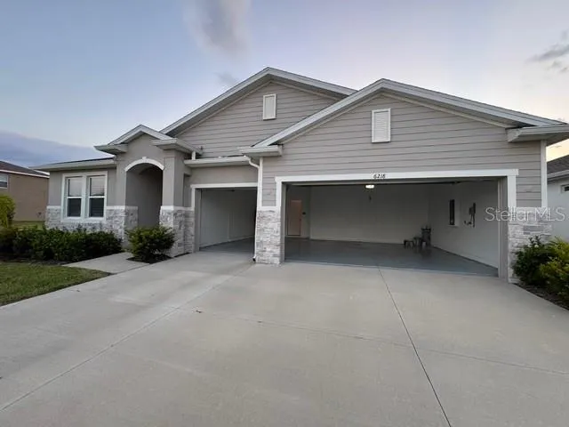 a front view of a house with garage and garage