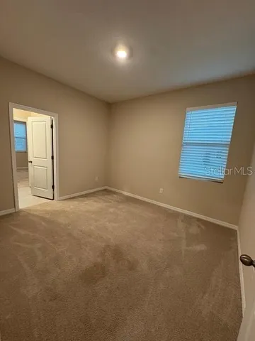 a white toilet and tub sitting next to a bathroom sink