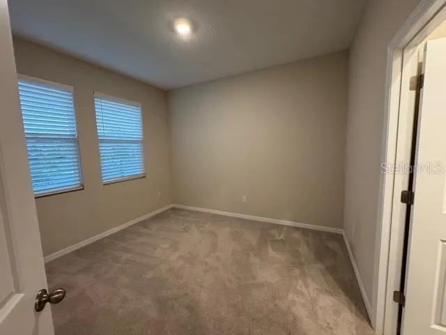 a view of a refrigerator in the kitchen