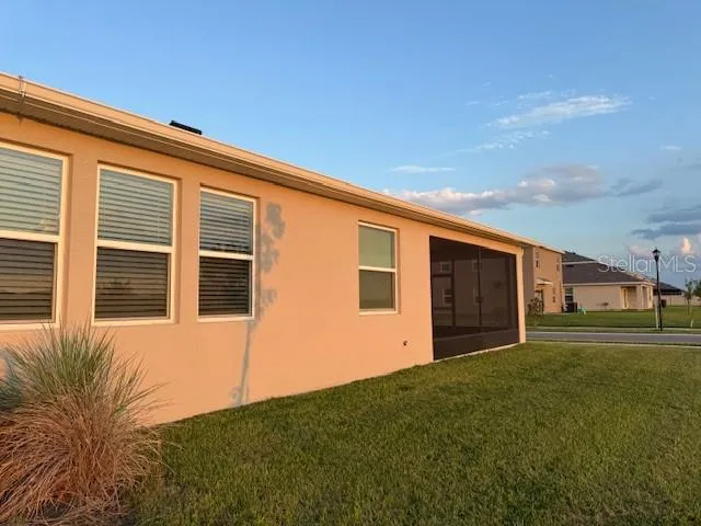 a view of an empty room with glass door