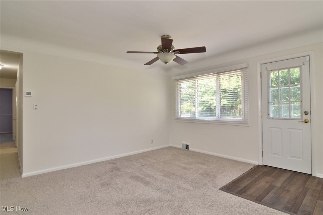981 Hanley Road Cleveland, OH 44124 - Photo 8 of 42 Empty room featuring light colored carpet and ceiling fan