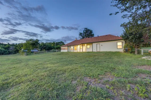 a view of a house with a big yard
