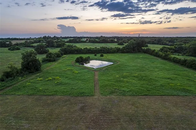 a view of a garden with a house
