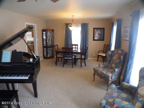 3036 Rosedale Boulevard Louisville, KY 40220 - Photo 2 of 14 Formal Living and Dining Room with hardwood floors under berber carpet.