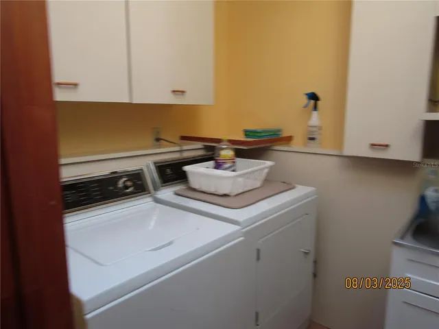 a white stove top oven sitting inside of a kitchen