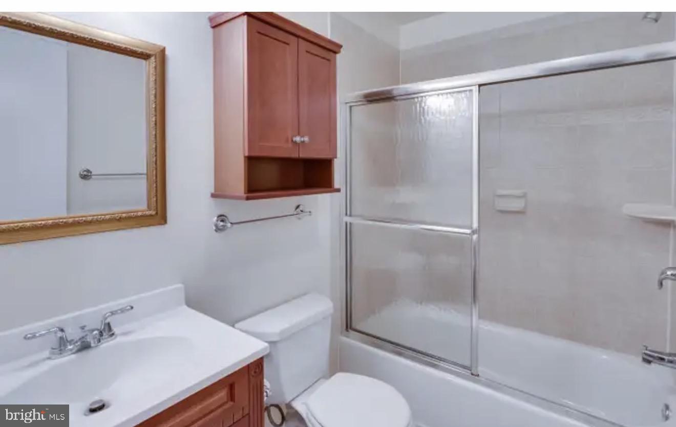 1707 Tyvale Court Vienna, VA 22182 - Photo 17 of 28 a bathroom with a sink toilet and shower