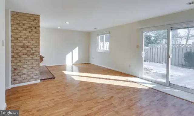 a bedroom with a bed and a fireplace