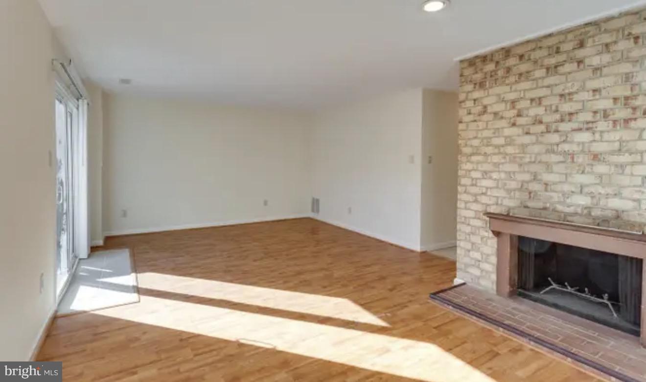 1707 Tyvale Court Vienna, VA 22182 - Photo 20 of 28 a bedroom with a bed and a fireplace