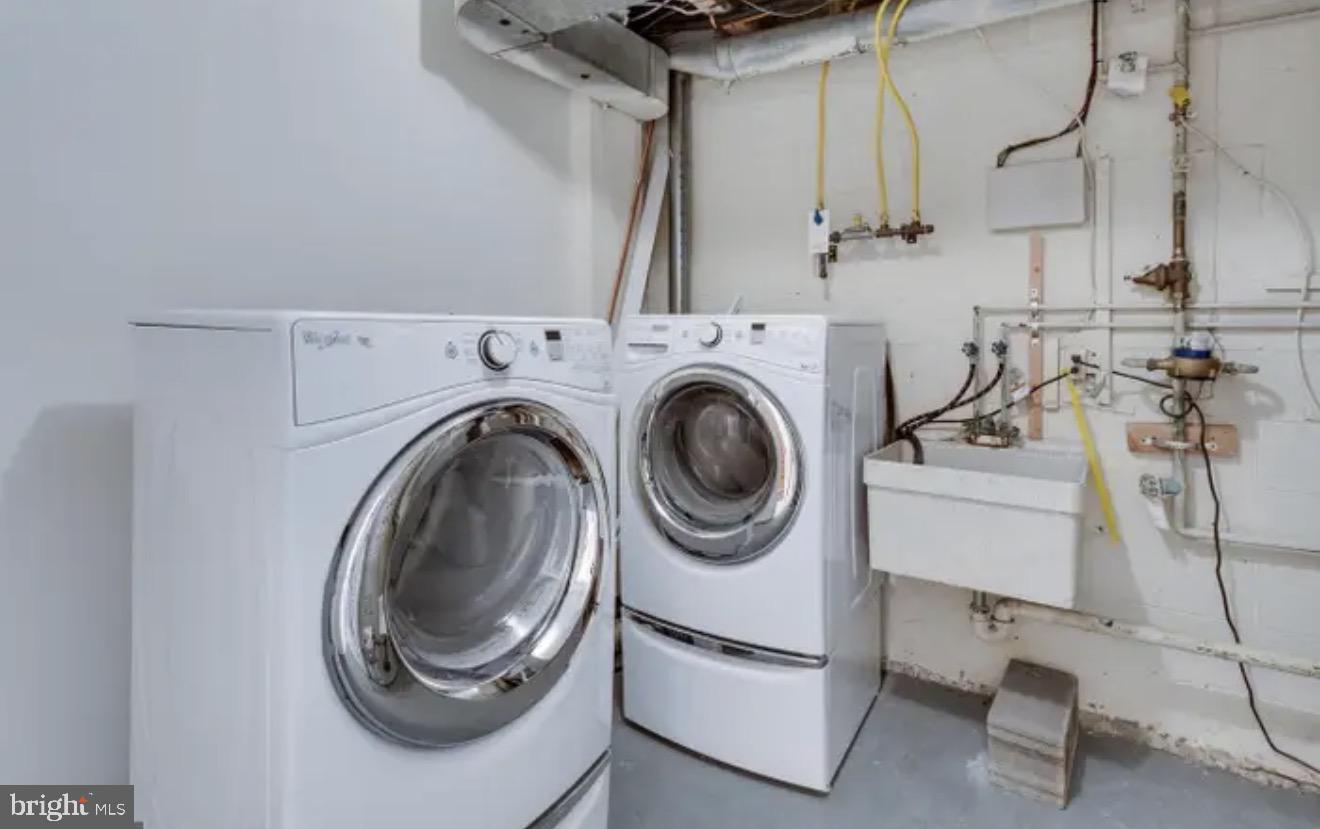 1707 Tyvale Court Vienna, VA 22182 - Photo 24 of 28 a utility room with dryer and washer