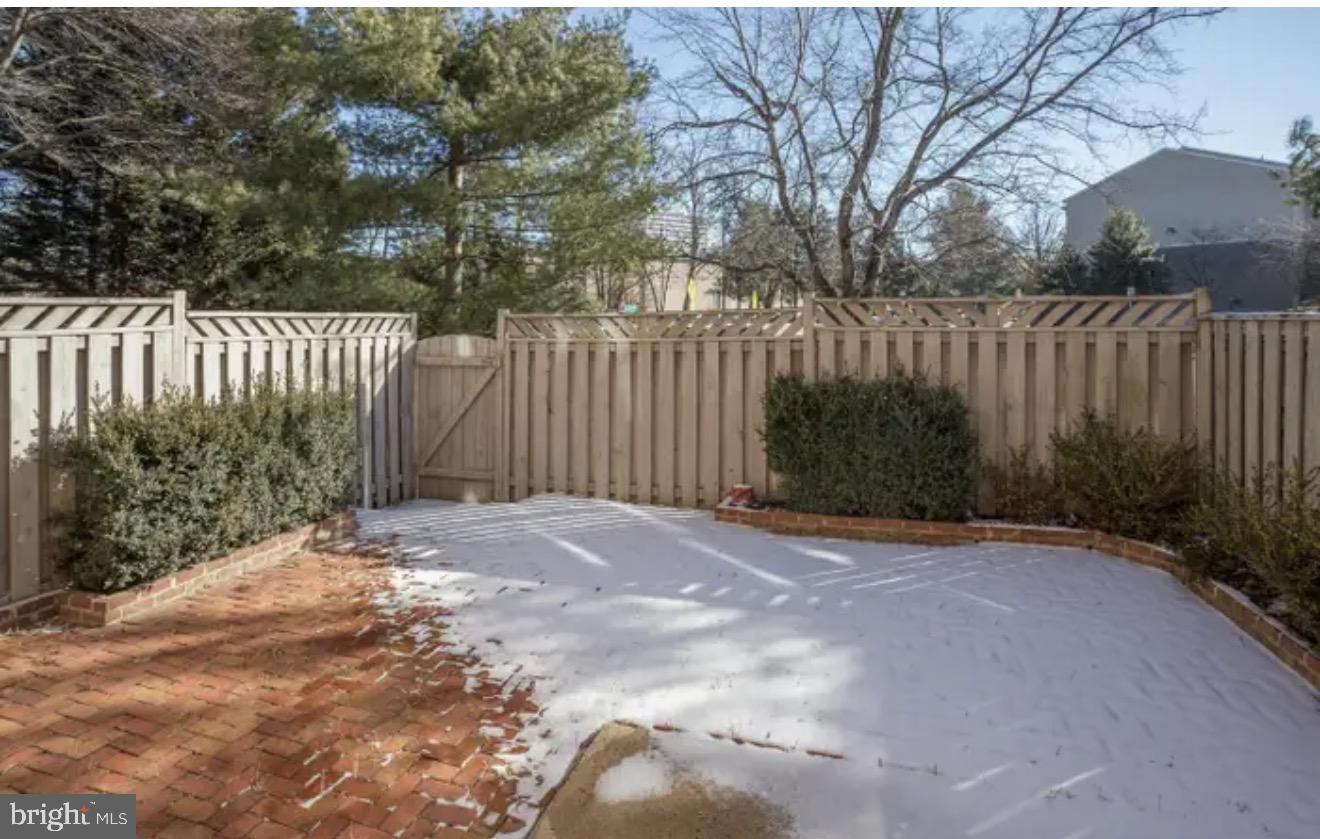 1707 Tyvale Court Vienna, VA 22182 - Photo 25 of 28 a view of a house with a wooden fence