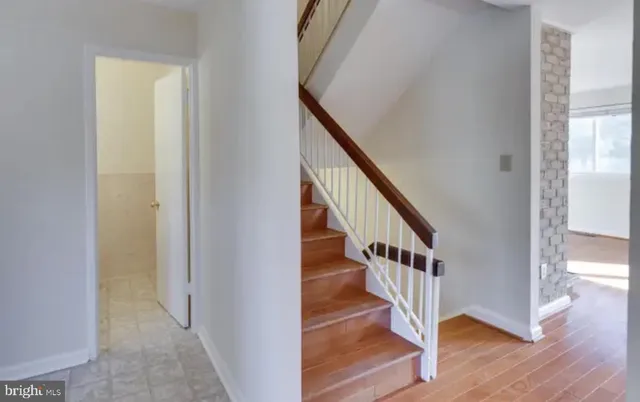 a bathroom with a sink mirror and toilet