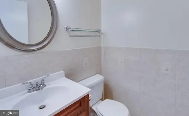 a view of hallway with wooden floor