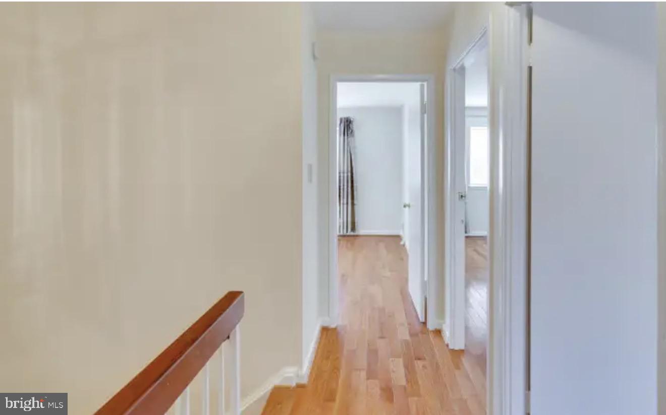 1707 Tyvale Court Vienna, VA 22182 - Photo 9 of 28 a view of hallway with wooden floor