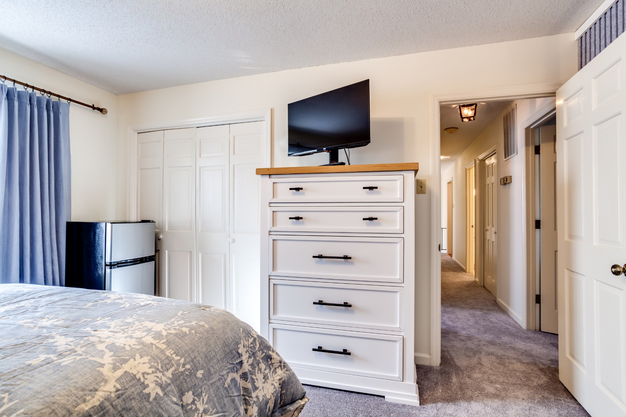 1434 Pine Springs Road Knoxville, TN 37922 - Photo 18 of 53 a bedroom with a bed and a flat screen tv