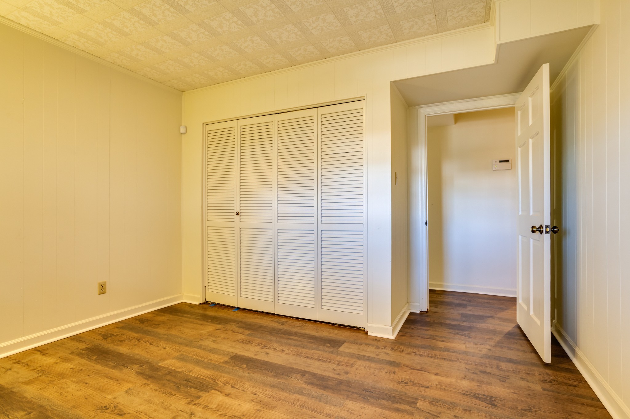 1434 Pine Springs Road Knoxville, TN 37922 - Photo 27 of 53 an empty room with wooden floor and windows