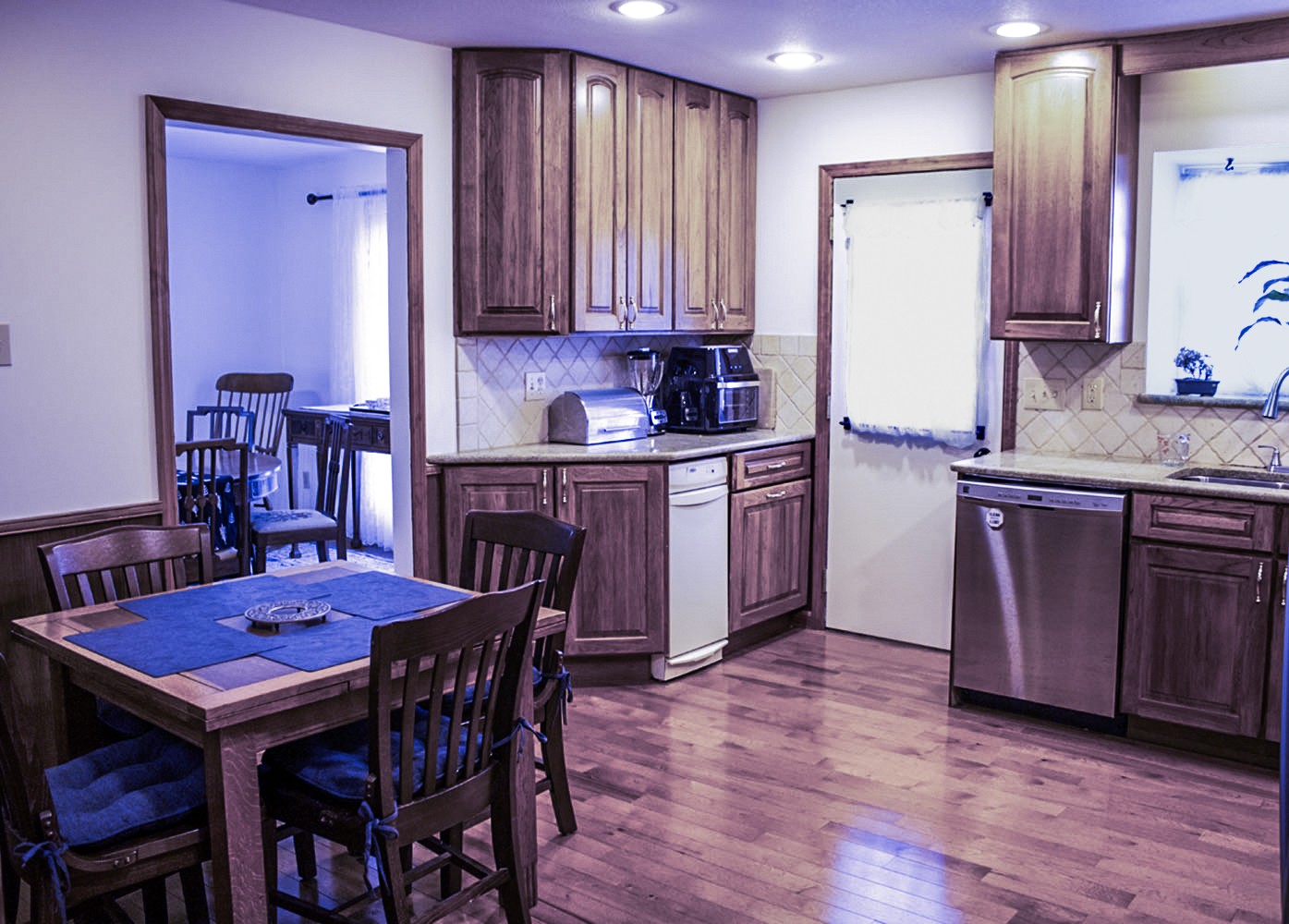 1434 Pine Springs Road Knoxville, TN 37922 - Photo 38 of 53 a kitchen with stainless steel appliances granite countertop a dining table chairs cabinets and wooden floor