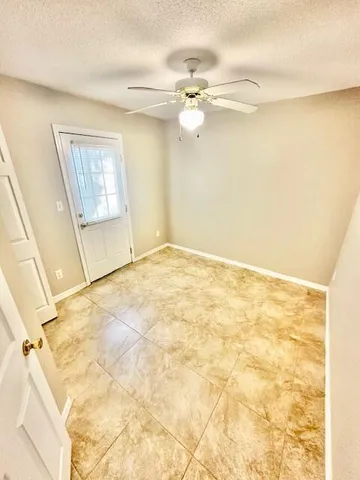 a view of a big room with closet and window