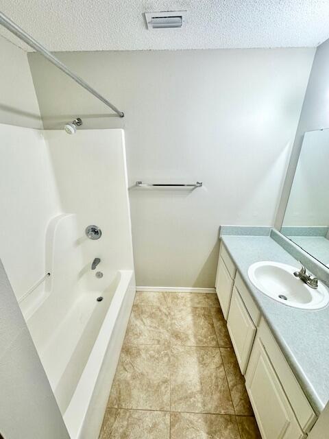 967 Tray Drive Fort Walton Beach, FL 32547 - Photo 19 of 26 a bathroom with a tub sink and mirror