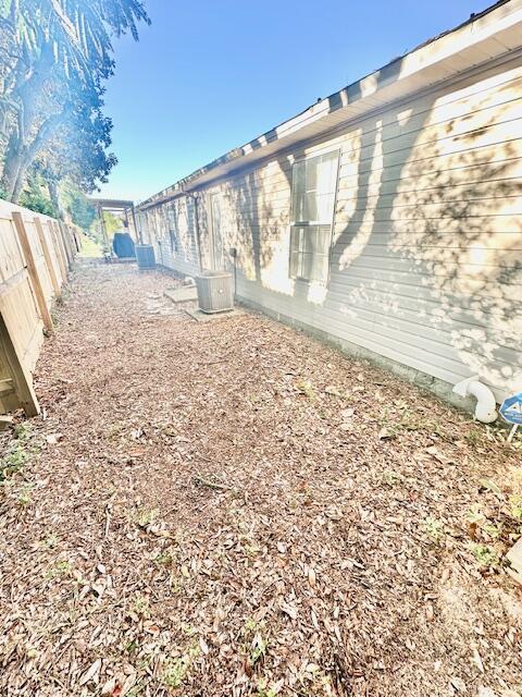 967 Tray Drive Fort Walton Beach, FL 32547 - Photo 26 of 26 a view of empty room with wooden floor and fence
