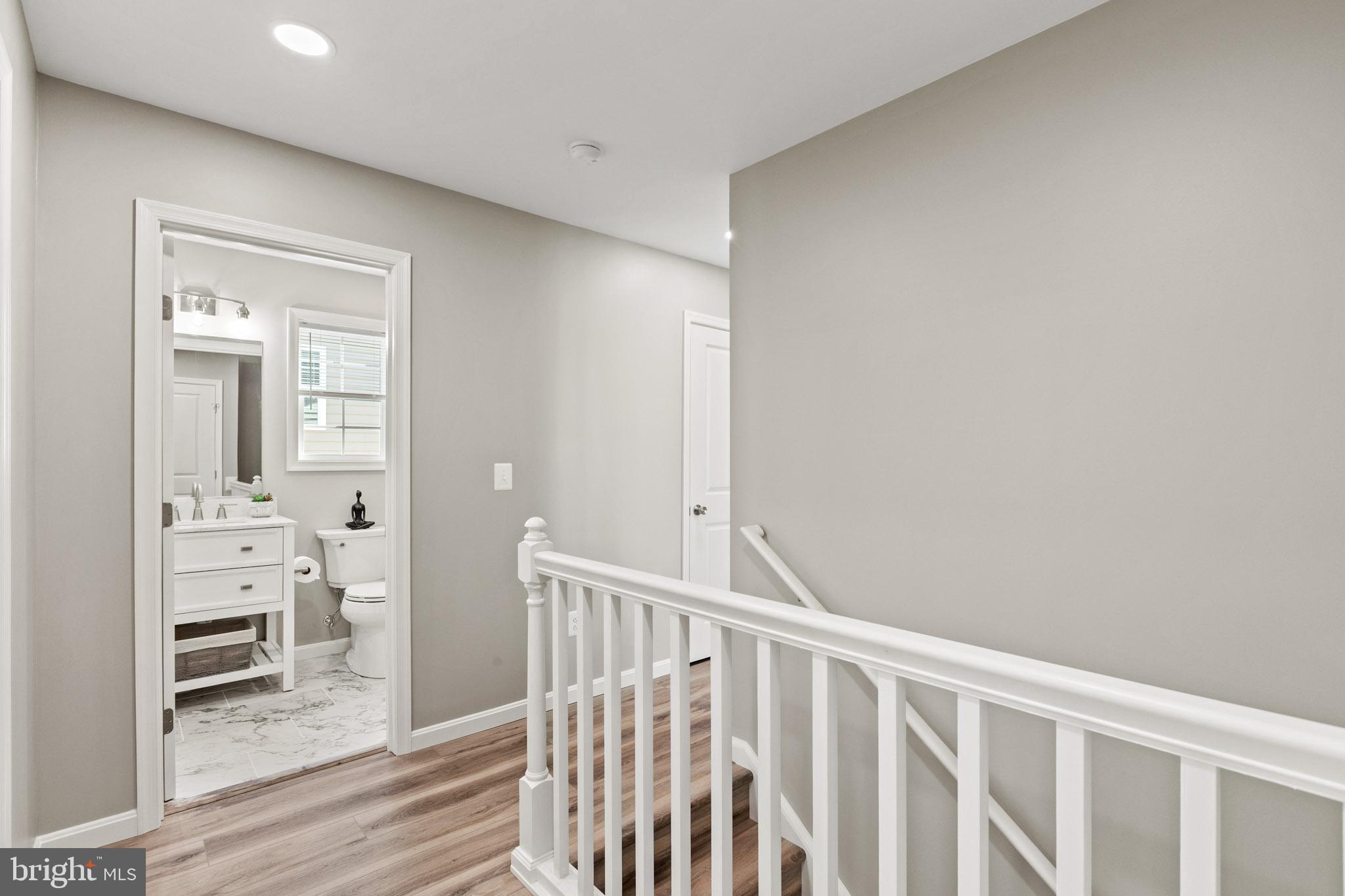 41573 Church Street Leonardtown, MD 20650 - Photo 16 of 27 a view of a hallway with a livingroom