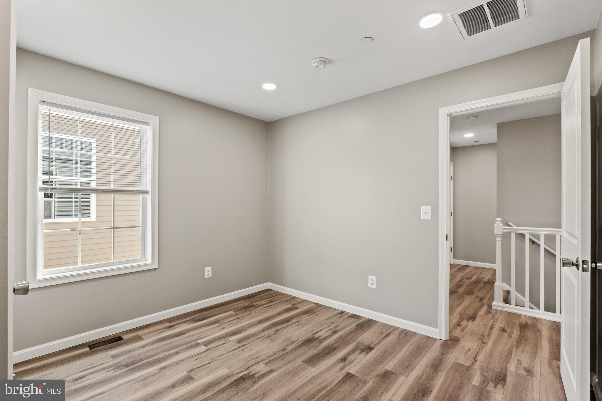 41573 Church Street Leonardtown, MD 20650 - Photo 21 of 27 a view of a room with wooden floor and a window