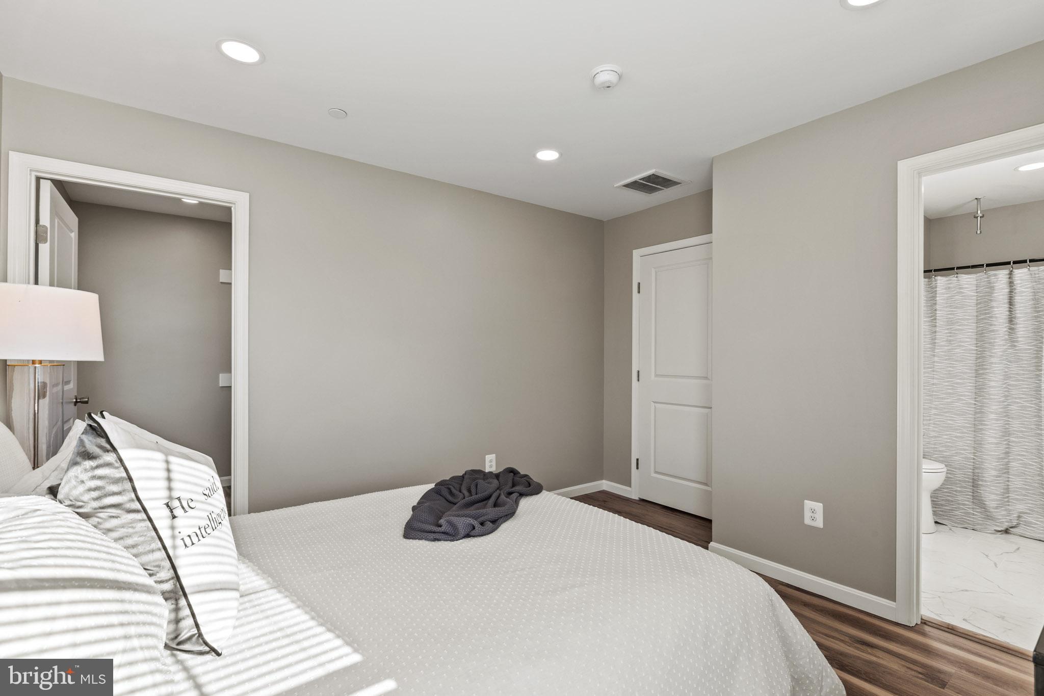 41573 Church Street Leonardtown, MD 20650 - Photo 24 of 27 a bedroom with a bed and a lamp