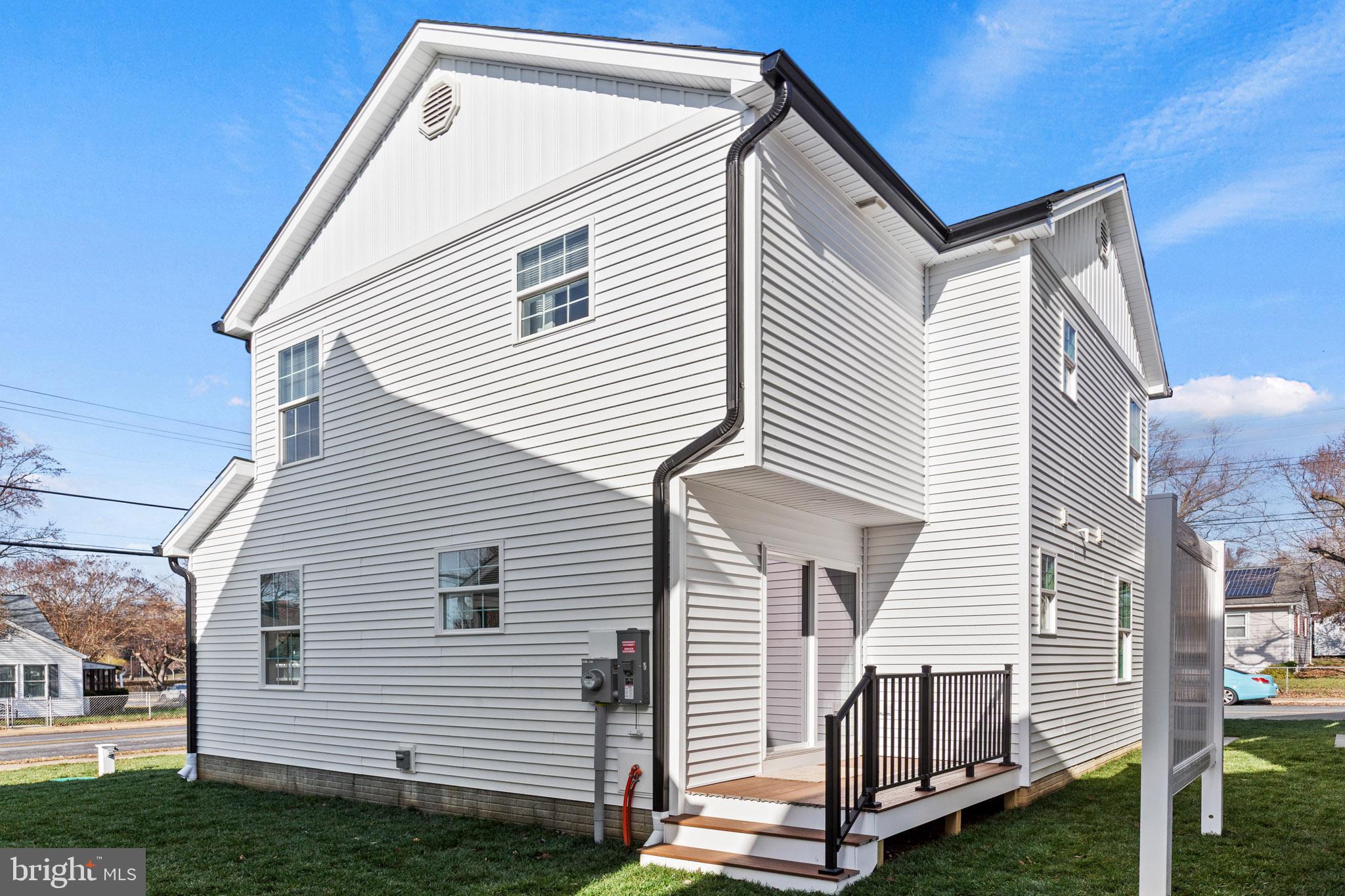 41573 Church Street Leonardtown, MD 20650 - Photo 27 of 27 a view of house that has a small deck and a yard