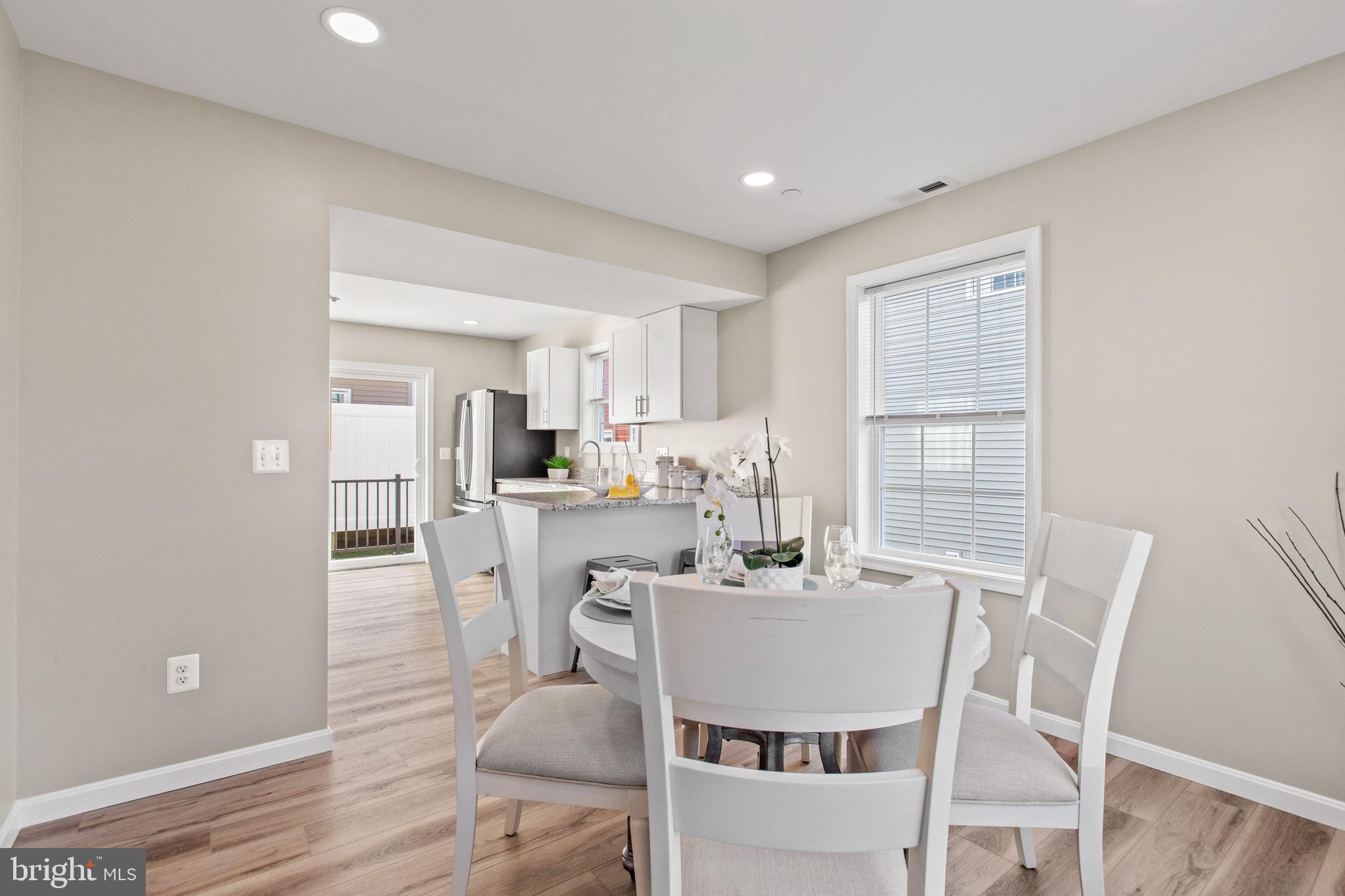 41573 Church Street Leonardtown, MD 20650 - Photo 8 of 27 a view of a dining room with furniture and wooden floor