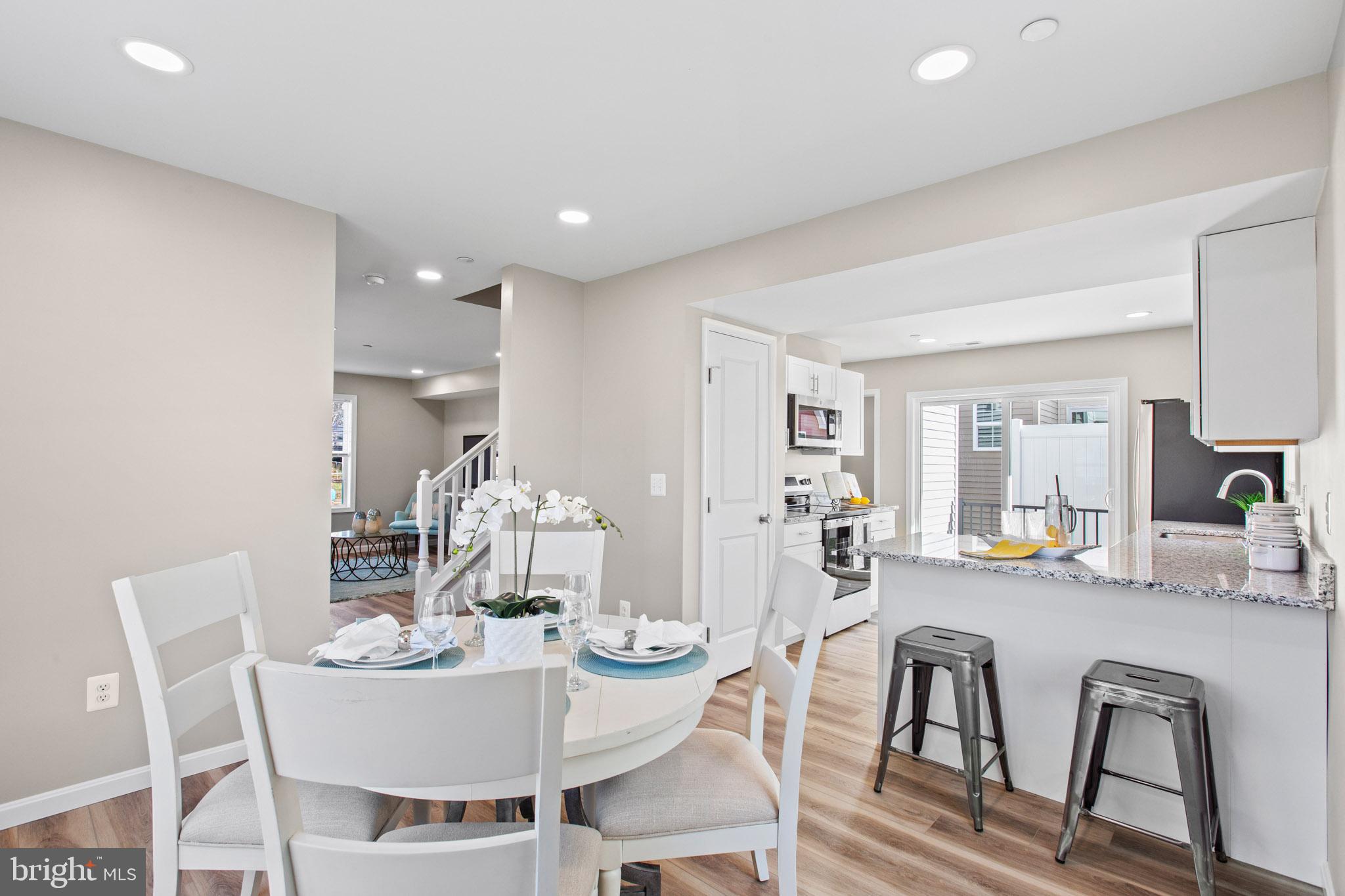 41573 Church Street Leonardtown, MD 20650 - Photo 9 of 27 a view of a dining room with furniture