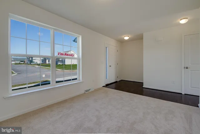 a view of a room with a large window