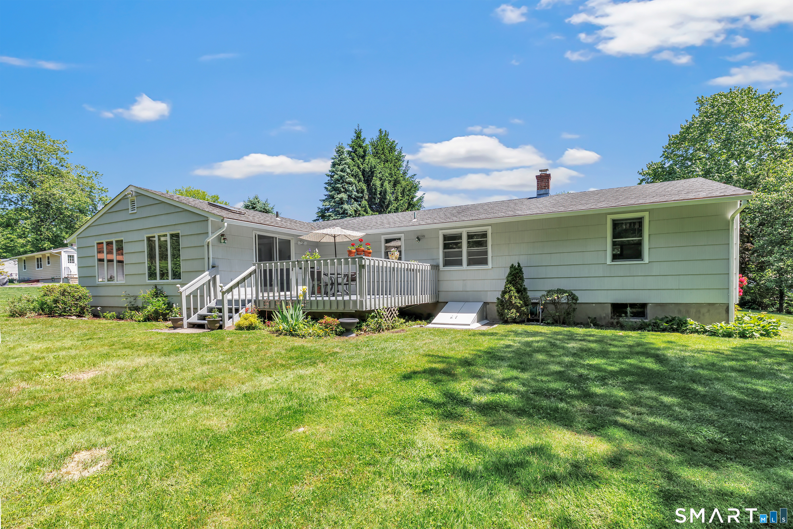 223 Wheeler Road Monroe, CT 06468 - Photo 29 of 35 a view of a house with a yard and sitting area