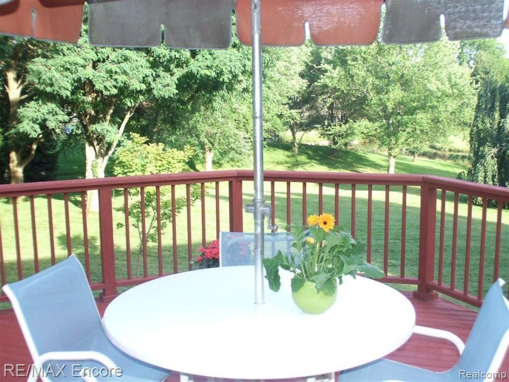 8550 Allen Road Clarkston, MI 48348 - Photo 24 of 26 Copper spindles compliment cedar