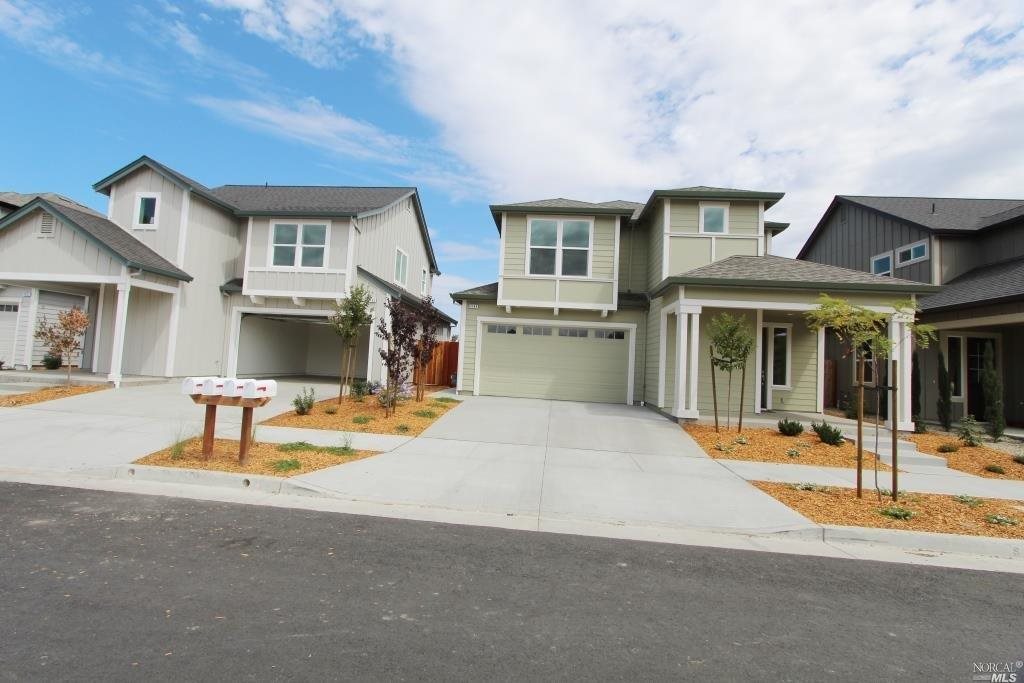 2153 Soleil Way Santa Rosa, CA 95403 - Photo 1 of 1 a front view of a house with a garden