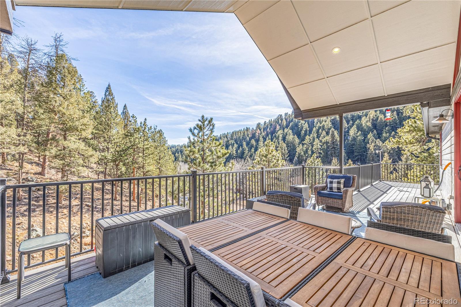 663 Brookside Drive Bailey, CO 80421 - Photo 3 of 47 a view of balcony with wooden floor and outdoor seating