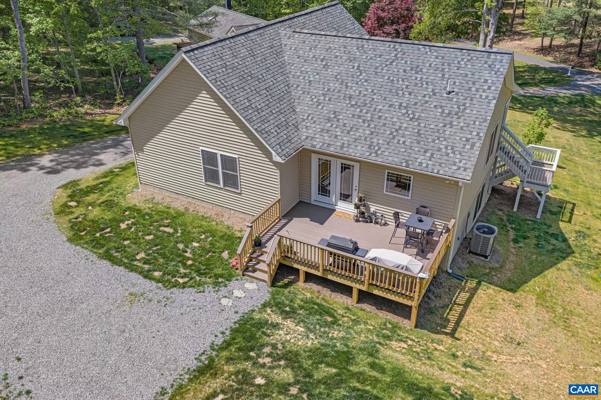 230 Fox Hollow Road Ruckersville, VA 22968 - Photo 38 of 42 a backyard of a house with outdoor seating