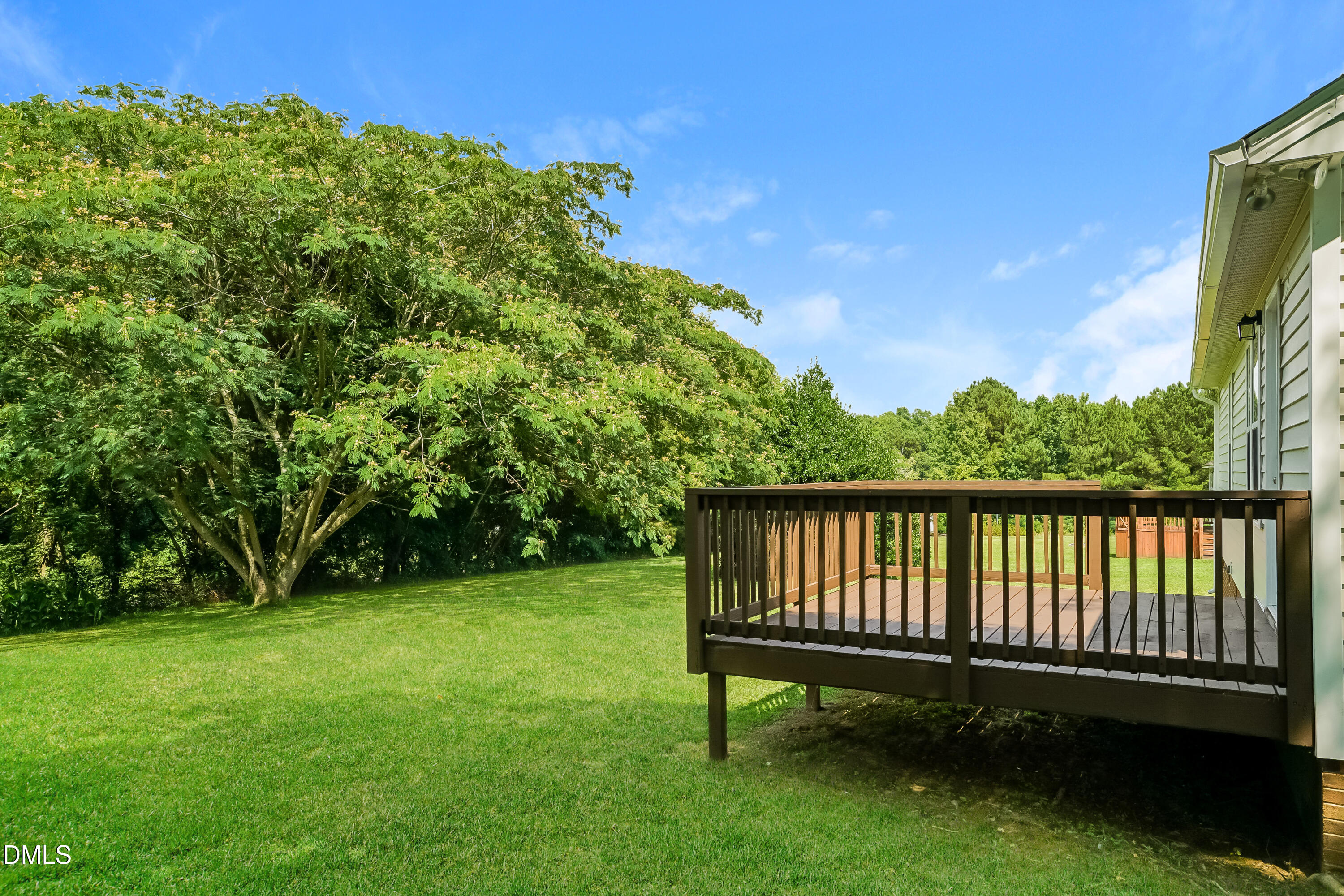 110 Impressive Lane Clayton, NC 27520 - Photo 14 of 16 a view of a backyard with a garden