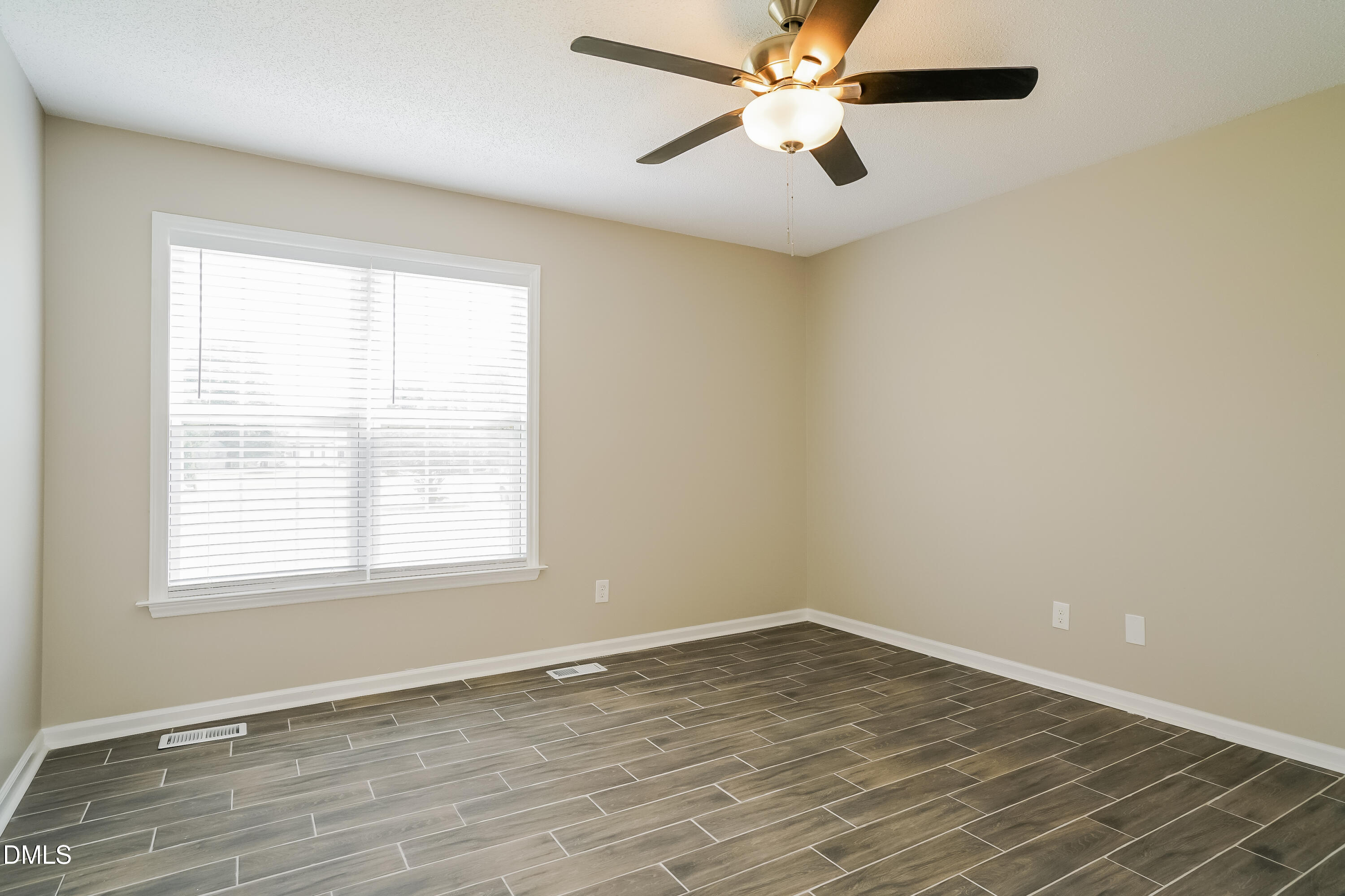 110 Impressive Lane Clayton, NC 27520 - Photo 7 of 16 an empty room with a window and a fan