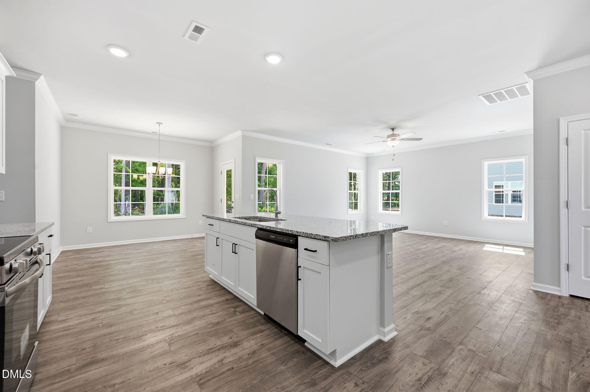 191 Nectar Lane Bunnlevel, NC 28323 - Photo 12 of 35 a large kitchen with stainless steel appliances a large counter top and a window