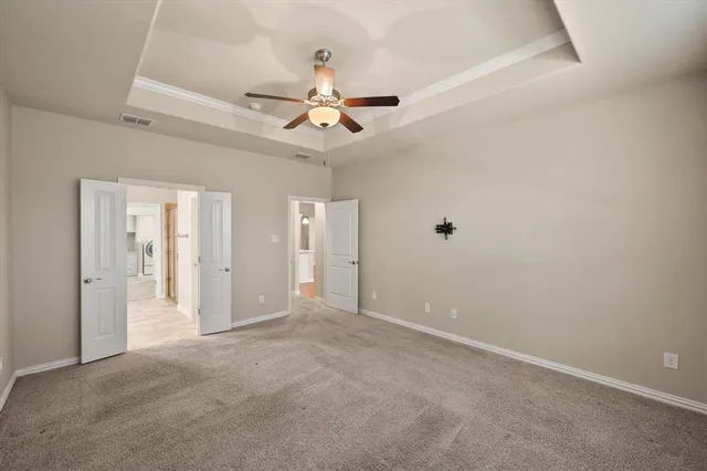 a view of a kitchen with granite countertop wooden floors stainless steel appliances and a fireplace