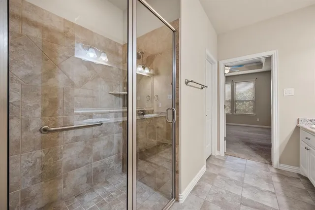 a bathroom with a granite countertop sink mirror and double