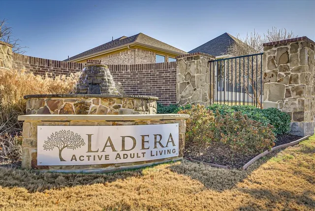 a living room with lots of furniture and a large window