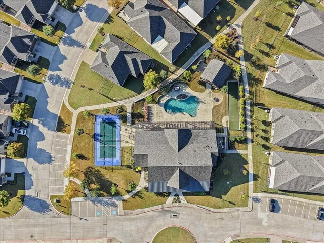 an aerial view of residential houses with outdoor space