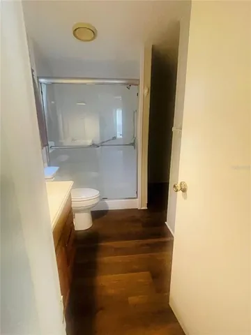 a bathroom with a toilet a sink and a mirror