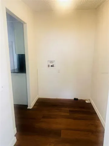 a kitchen with cabinets and stainless steel appliances