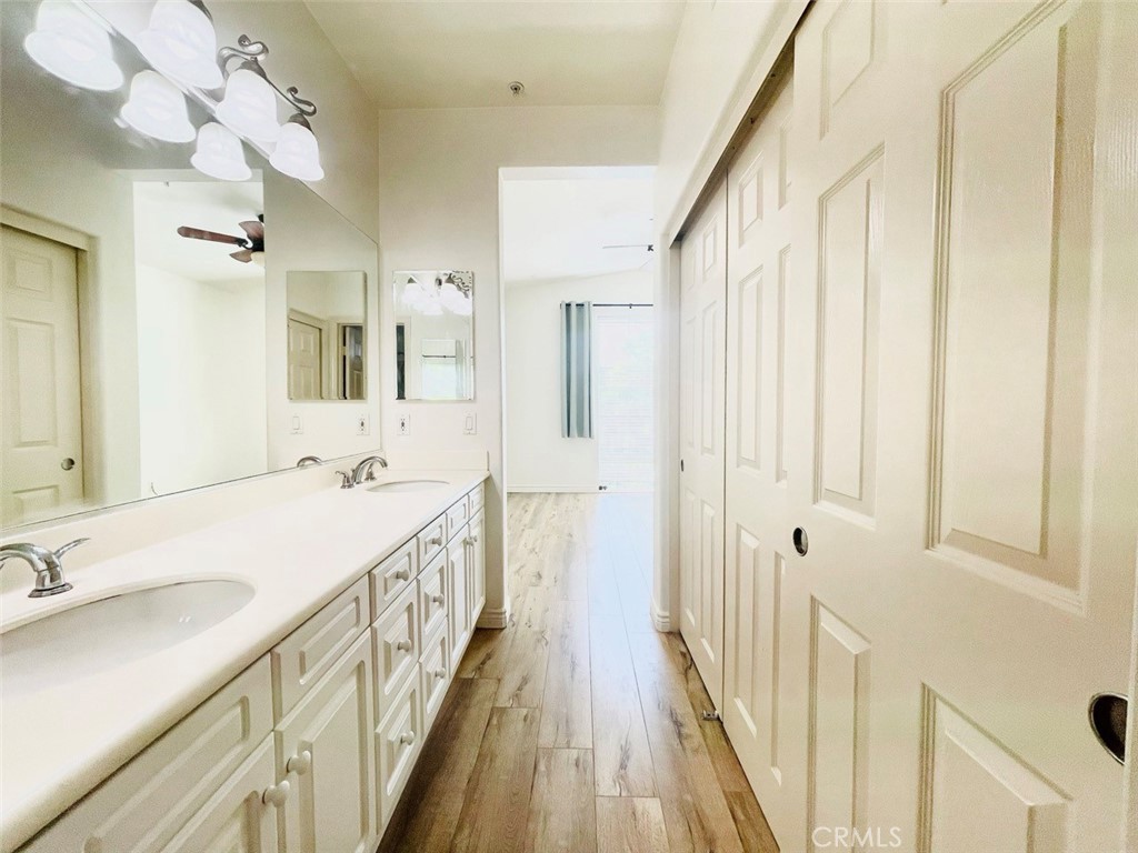65 Passage Irvine, CA 92603 - Photo 23 of 28 a bathroom with a double vanity sink and mirror